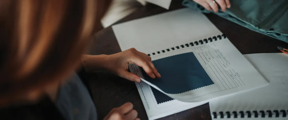 Woman choosing blue fabric
